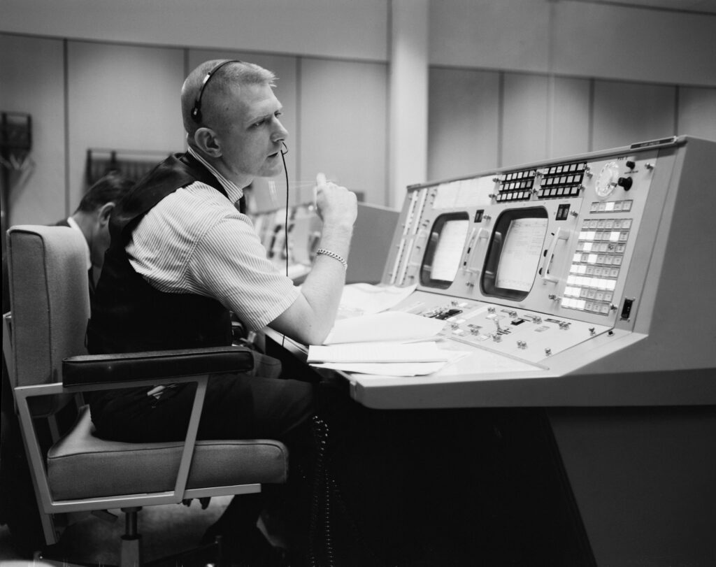 Man at an old computer board